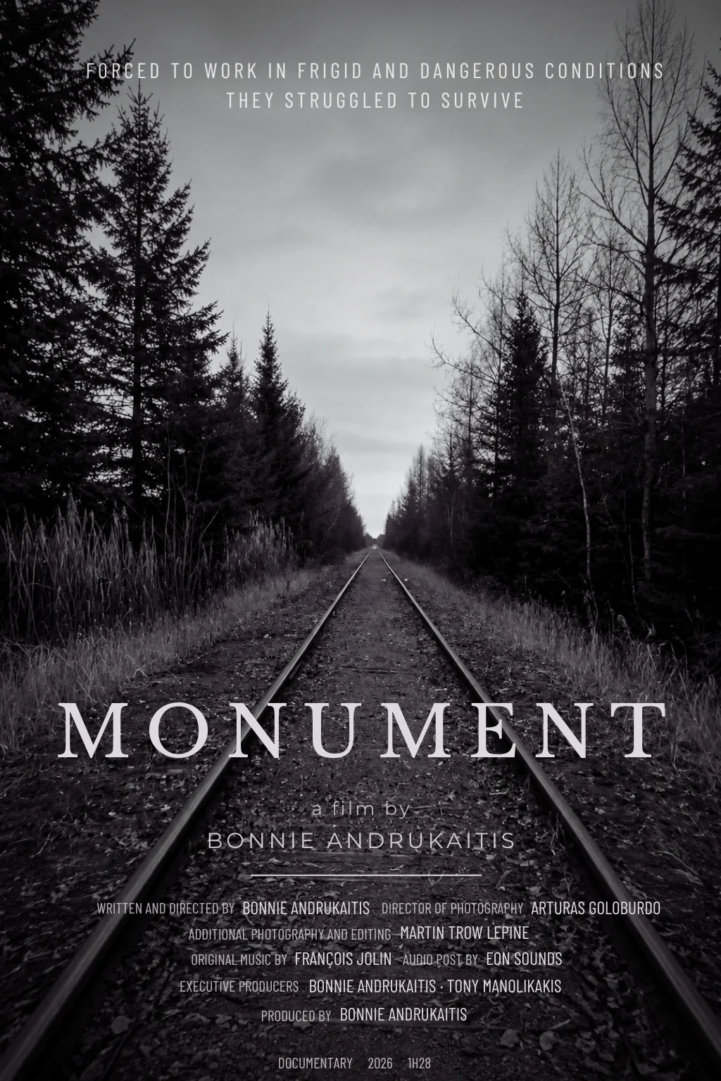 MONUMENT film poster with railway tracks between trees.