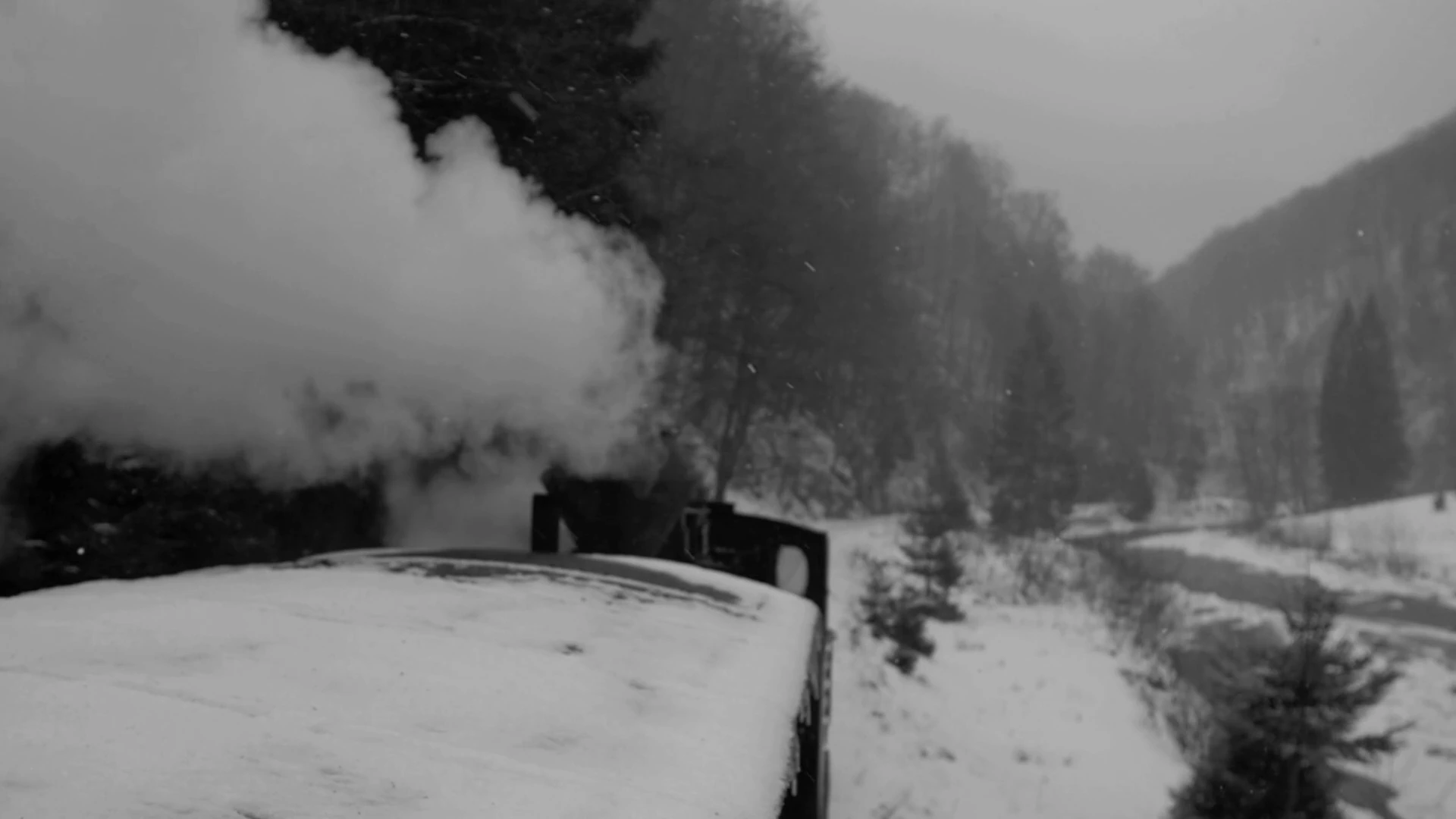 A steam train travelling through a snowy landscape in MONUMENT.